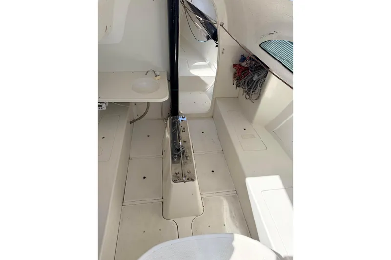 Slide: The Image of Interior of a 2007 Flying Tiger 10M sailboat, featuring a clean, white cabin space. - 42