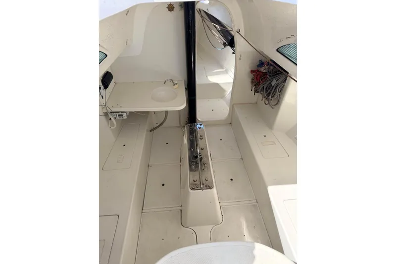 Slide: The Image of Interior of a 2007 Flying Tiger 10M sailboat, featuring a compact cabin layout. - 43