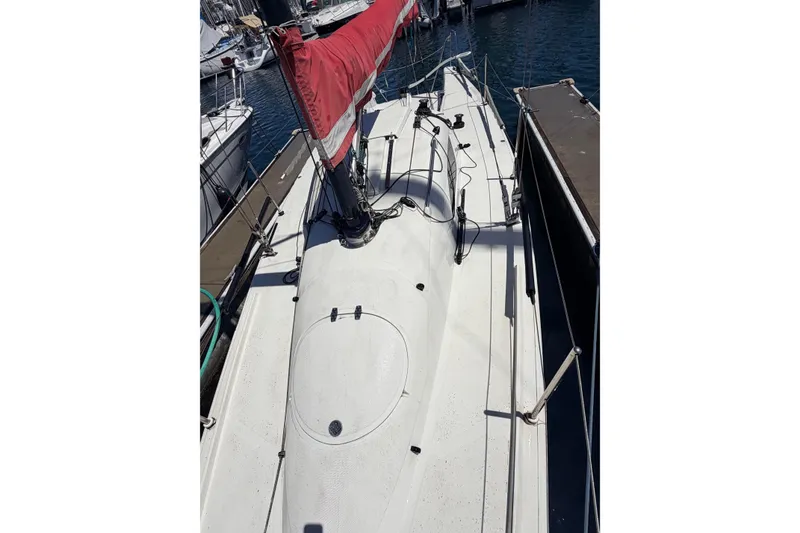 Slide: The Image of Sailboat docked at marina, Flying Tiger 10M, 2007 model, with red sail cover. - 48