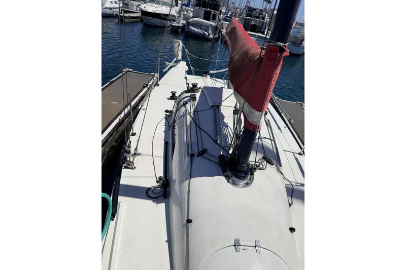 Slide: The Image of Sailboat docked at marina, Flying Tiger 10M, 2007 model, with red sail cover. - 49