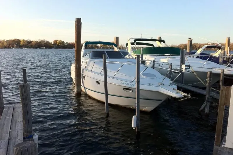 Slide: The Image of 1995 Chris Craft 34 Crowne boat docked at marina on a sunny day. - 3