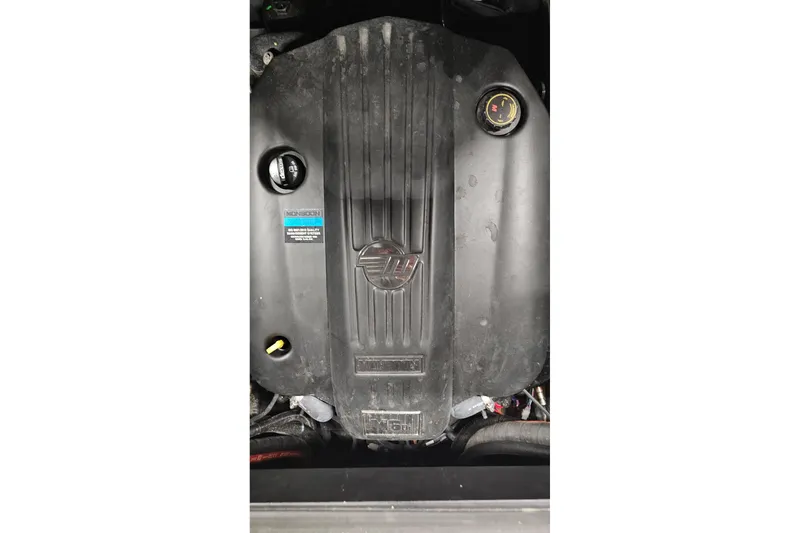 Slide: The Image of 2023 Malibu M220 engine cover with branding and oil cap visible. - 4