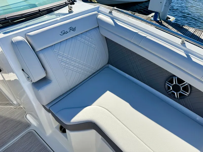 Slide: The Image of The 2026 Sea Ray SDX 290 Outboard features a luxurious, cushioned seat with elegant stitching. - 17
