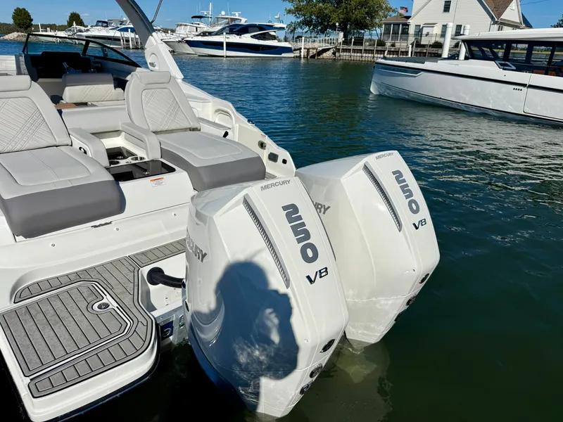 Slide: The Image of The image shows a Sea Ray SDX 290 Outboard boat with twin Mercury 250 V8 engines. - 6