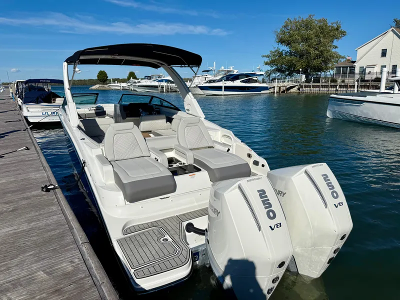 Slide: The Image of 2026 Sea Ray SDX 290 Outboard at dock with twin Mercury V8 engines. - 3