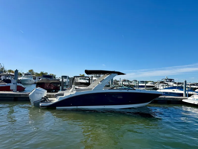 The Image of A 2026 Sea Ray SDX 290 Outboard is docked on a sunny day. - 0