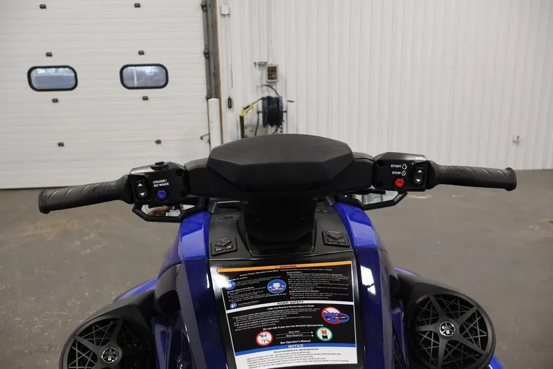 Slide: The Image of 2026 Yamaha WaveRunner VX Limited HO handlebars and controls in a garage setting. - 8