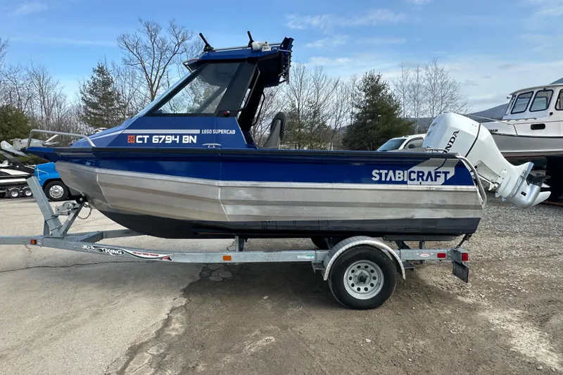 Slide: The Image of 2021 Stabicraft 1850 SuperCab boat on trailer with Honda outboard motor. - 4