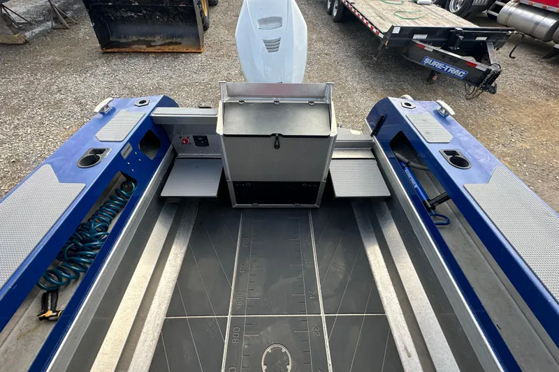 Slide: The Image of 2021 Stabicraft 1850 SuperCab interior with blue accents and storage compartments. - 9