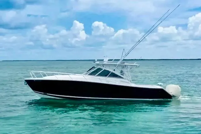 The Image of 2009 Jupiter 39 Express boat on clear turquoise water under a blue sky. - 0