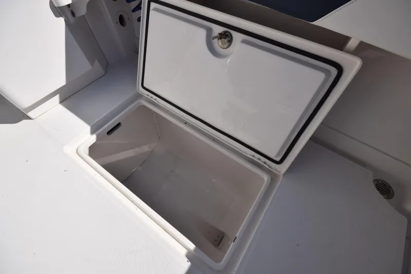 Slide: The Image of Open storage compartment on 2009 Jupiter 39 Express boat, showcasing interior space. - 10