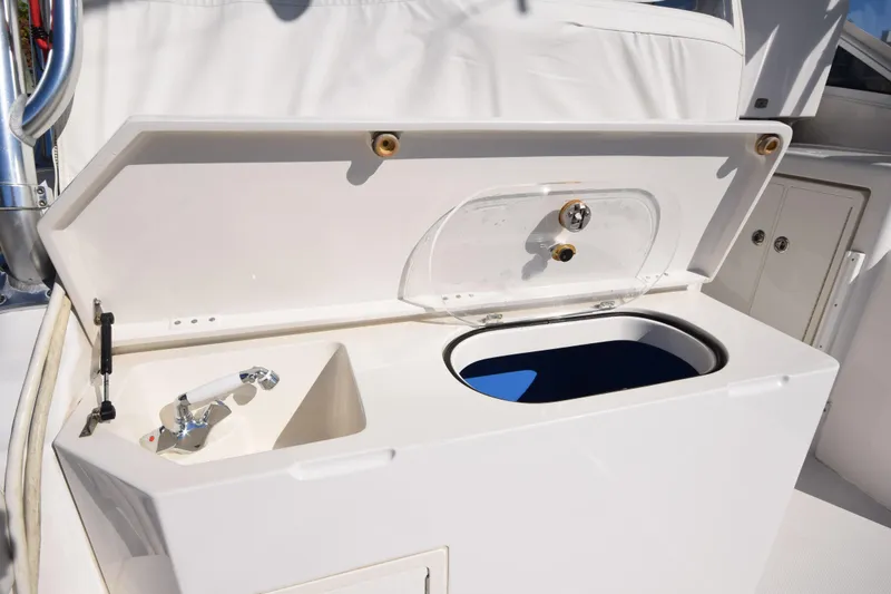 Slide: The Image of 2009 Jupiter 39 Express boat with open storage compartment and faucet. - 11