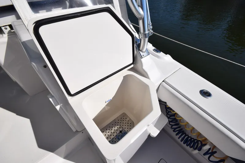 Slide: The Image of Open storage compartment on 2009 Jupiter 39 Express boat deck. - 12