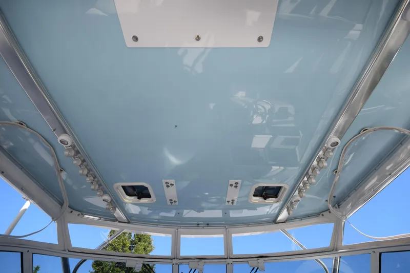 Slide: The Image of 2009 Jupiter 39 Express boat ceiling with blue finish and mounted lights. - 14