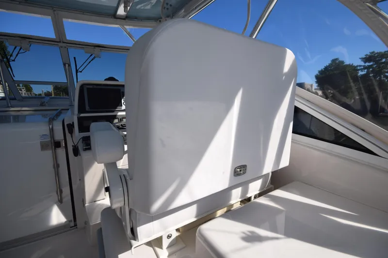 Slide: The Image of 2009 Jupiter 39 Express boat interior with helm station and seating. - 17