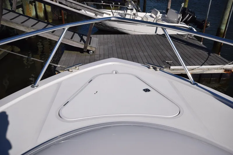 Slide: The Image of Bow view of 2009 Jupiter 39 Express boat docked at marina. - 21