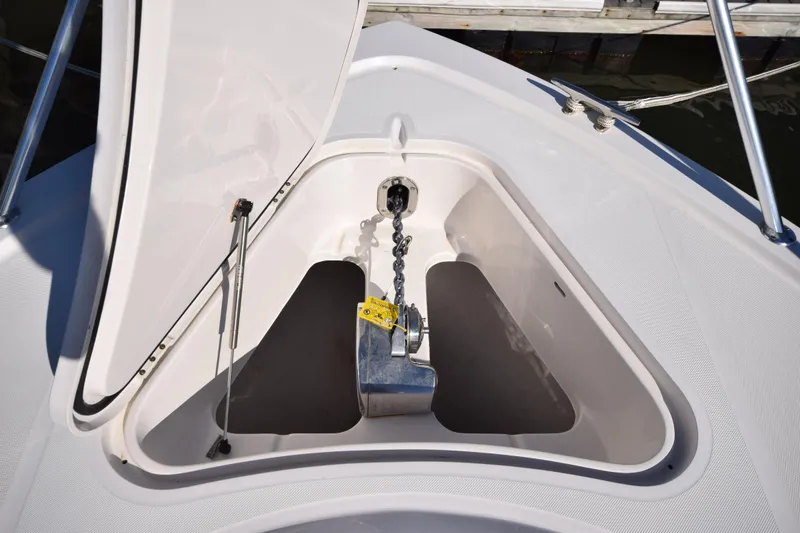 Slide: The Image of Anchor compartment of 2009 Jupiter 39 Express boat, open hatch, chain visible. - 22