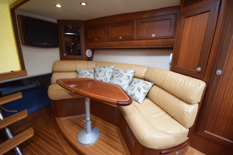 Slide: The Image of Luxurious interior of 2009 Jupiter 39 Express yacht with leather seating and wooden finishes. - 24