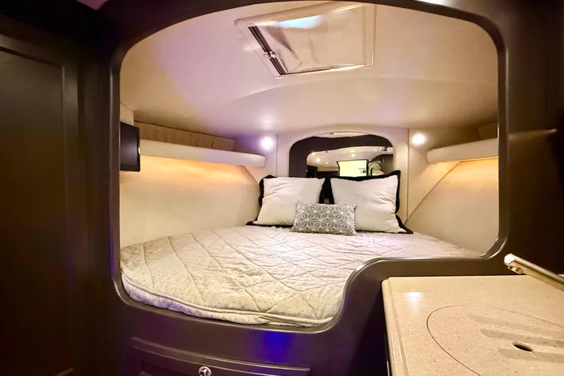 Slide: The Image of Luxurious cabin interior of 2009 Jupiter 39 Express boat with cozy bedding. - 30