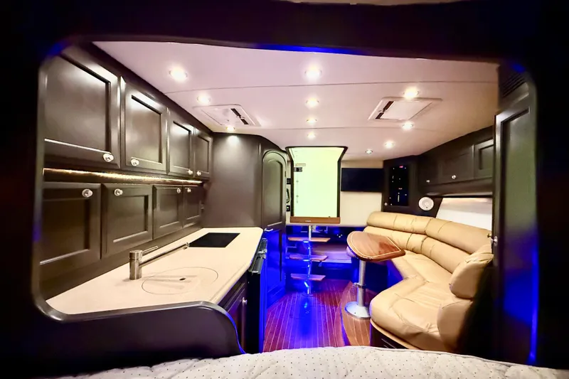 Slide: The Image of Luxurious interior of a 2009 Jupiter 39 Express yacht with modern kitchen and seating area. - 31