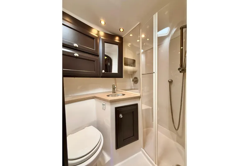 Slide: The Image of Luxurious bathroom in 2009 Jupiter 39 Express yacht with modern fixtures and elegant cabinetry. - 32