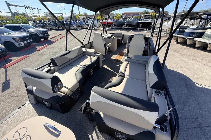 Slide: The Image of 2026 Avalon 2585 LSZ Quad Lounger Tri Toon with high-performance seating, parked outdoors. - 11