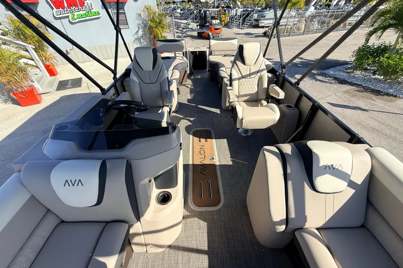 Slide: The Image of 2026 Avalon 2585 LSZ Quad Lounger Tri Toon boat interior with luxurious seating and helm. - 18