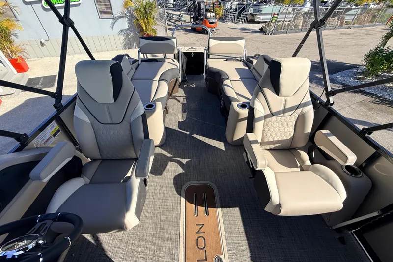 Slide: The Image of Luxurious interior of 2026 Avalon 2585 LSZ Quad Lounger Tri Toon boat, featuring plush seating. - 19