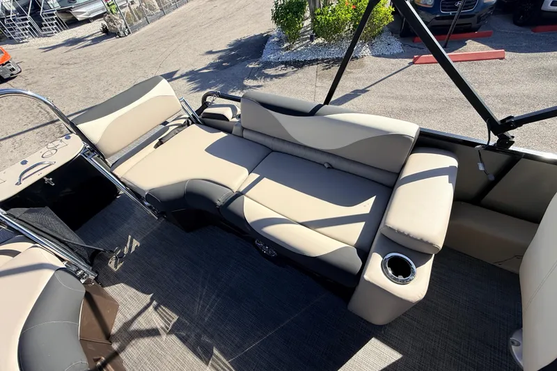 Slide: The Image of 2026 Avalon 2585 LSZ Quad Lounger interior with beige seating and cup holder. - 22