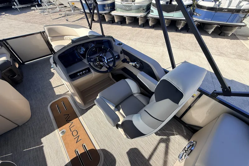 Slide: The Image of Interior of 2026 Avalon 2585 LSZ Quad Lounger, showcasing helm and seating. - 24