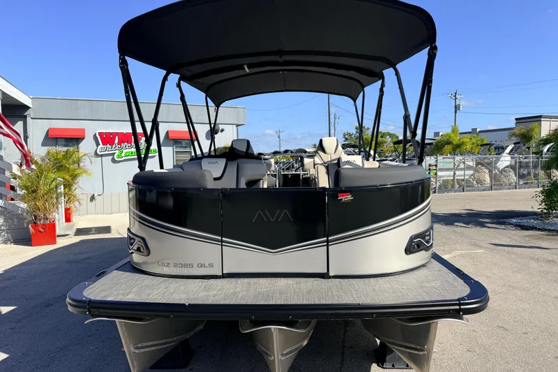 Slide: The Image of 2026 Avalon 2585 LSZ Quad Lounger Tri Toon boat at dealership, high performance model. - 4