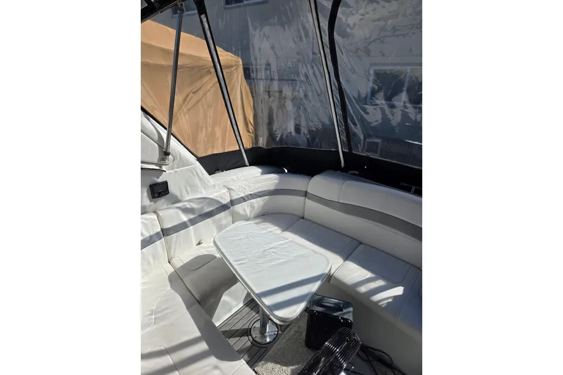 Slide: The Image of 2007 Formula 34 Performance Cruiser interior with white seating and table. - 10