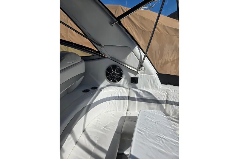 Slide: The Image of Interior of a 2007 Formula 34 Performance Cruiser with white seating and speaker system. - 12