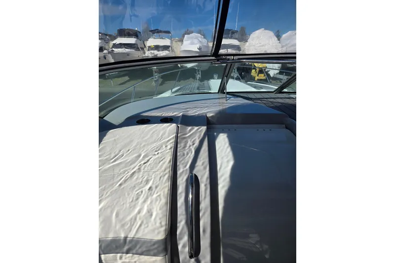 Slide: The Image of 2007 Formula 34 Performance Cruiser interior with white seating and clear windshield. - 14