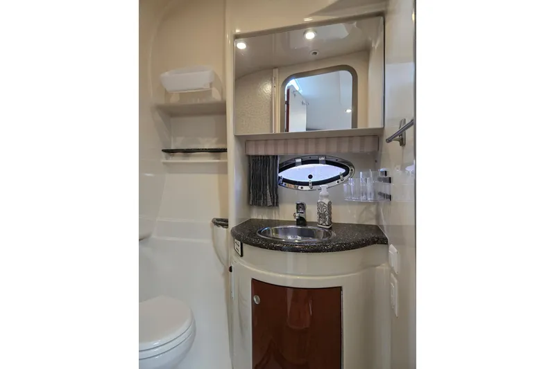 Slide: The Image of 2007 Formula 34 Performance Cruiser bathroom with sink, mirror, and storage shelves. - 17