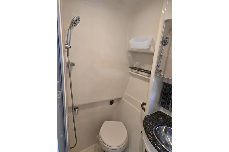 Slide: The Image of Compact bathroom in 2007 Formula 34 Performance Cruiser with shower and toilet. - 18
