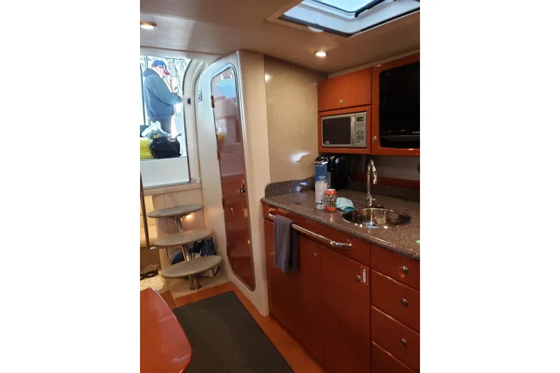 Slide: The Image of 2007 Formula 34 Performance Cruiser interior with kitchenette and stairs. - 2