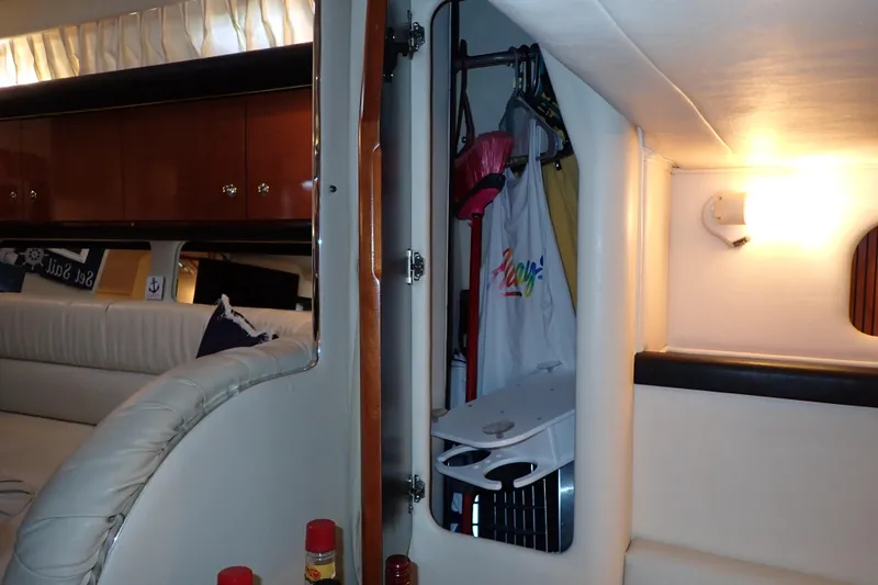 Slide: The Image of Interior of 2002 Sea Ray 340 Sundancer yacht with seating and storage area. - 109