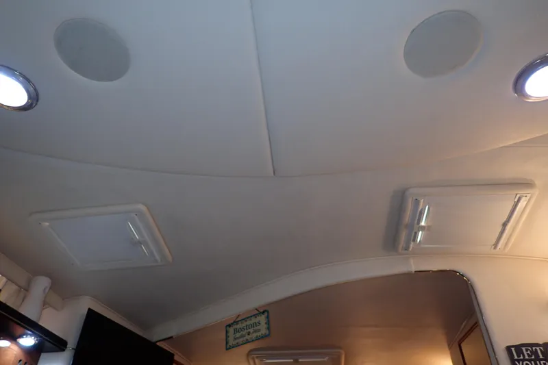 Slide: The Image of Interior ceiling of 2002 Sea Ray 340 Sundancer boat with lights and vents. - 113