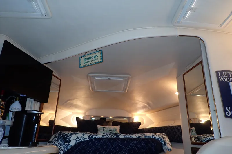 Slide: The Image of Interior of 2002 Sea Ray 340 Sundancer with cozy bed and modern amenities. - 114