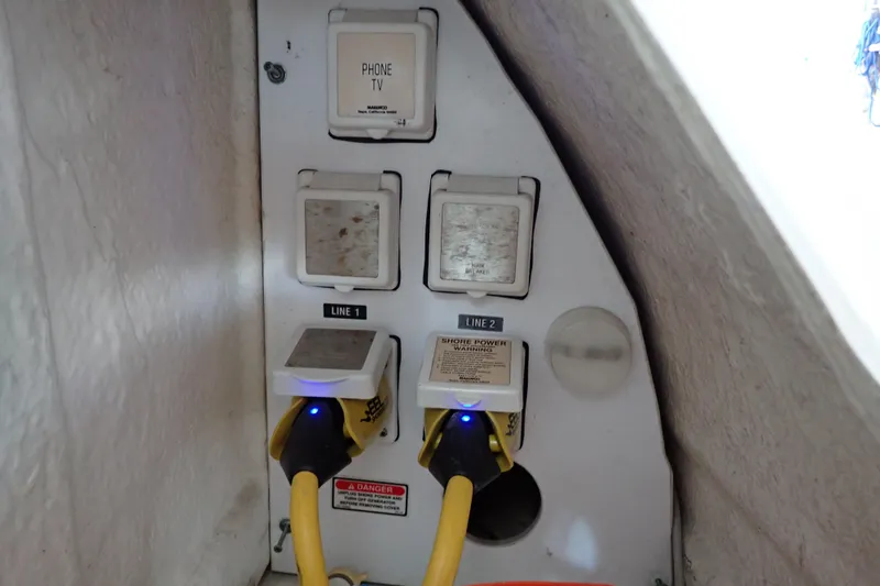Slide: The Image of Electrical panel with shore power connections on 2002 Sea Ray 340 Sundancer boat. - 123