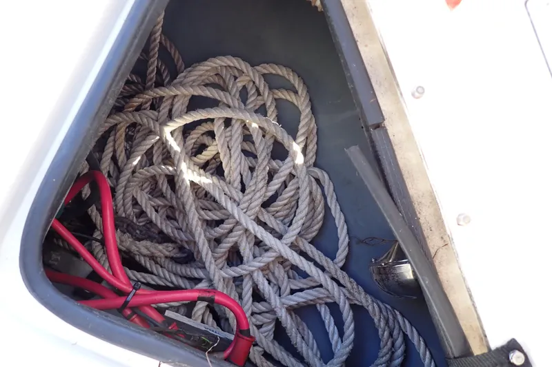 Slide: The Image of Storage compartment of 2002 Sea Ray 340 Sundancer with ropes and cables. - 127