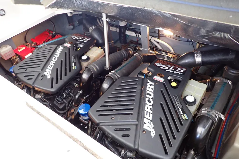 Slide: The Image of Engine compartment of 2002 Sea Ray 340 Sundancer with twin Mercury engines. - 132