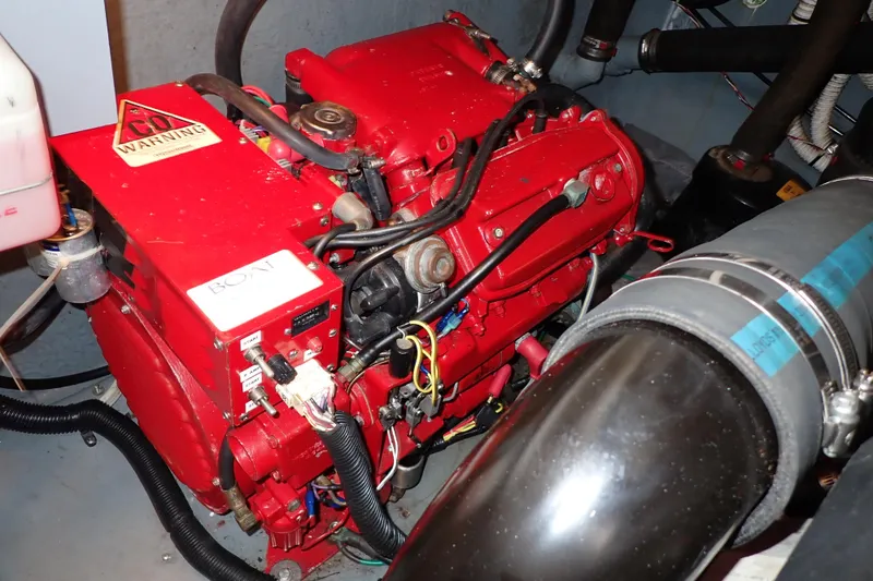 Slide: The Image of Engine compartment of a 2002 Sea Ray 340 Sundancer with a red engine block. - 134