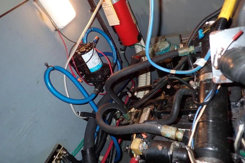 Slide: The Image of Engine room of 2002 Sea Ray 340 Sundancer with visible wiring and components. - 138