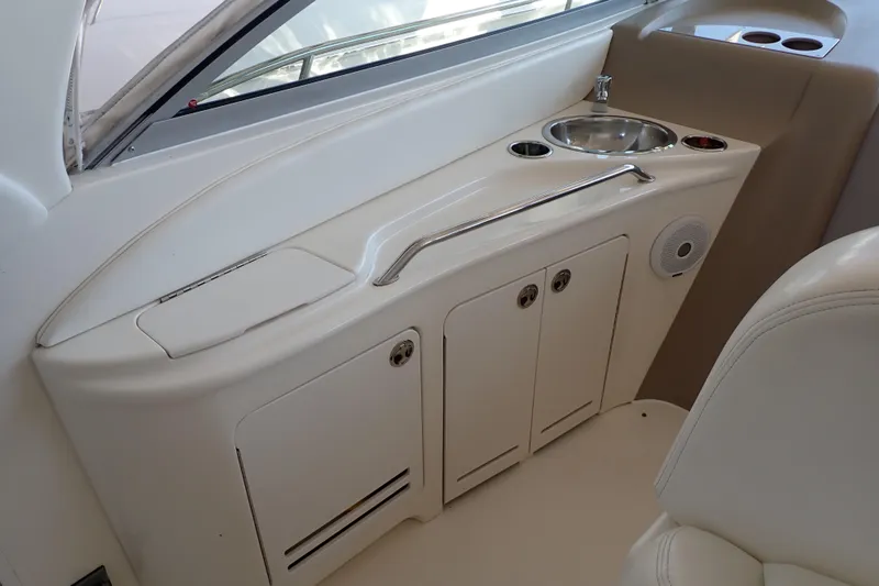 Slide: The Image of 2002 Sea Ray 340 Sundancer interior with sink and storage cabinets. - 14