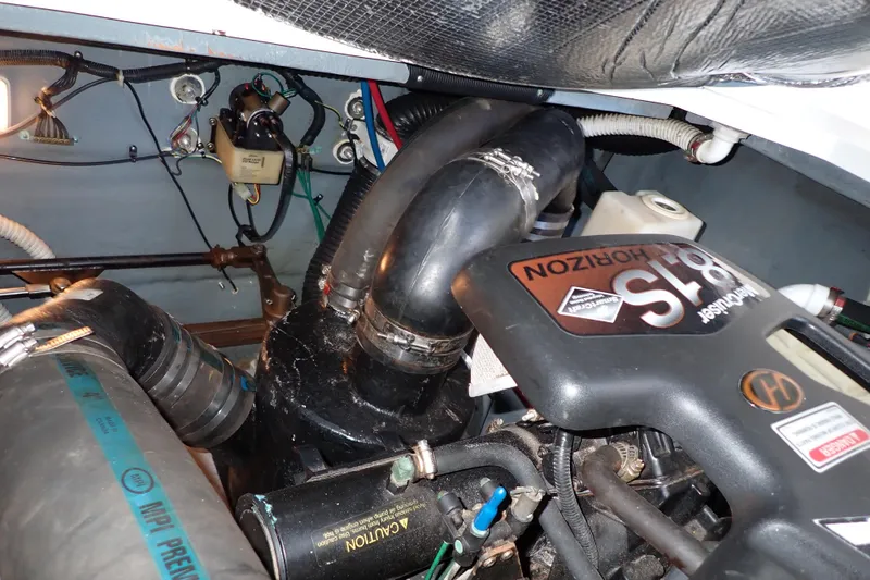 Slide: The Image of Engine compartment of 2002 Sea Ray 340 Sundancer boat, featuring MerCruiser 8.1S Horizon engine. - 140