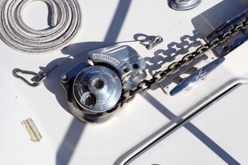 Slide: The Image of Anchor chain and winch on 2002 Sea Ray 340 Sundancer boat deck. - 21