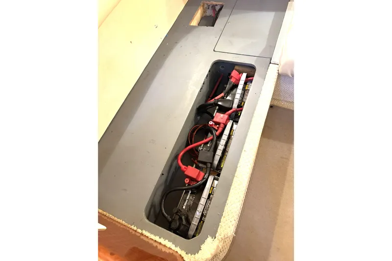 Slide: The Image of Battery compartment of a 2002 Sea Ray 340 Sundancer boat with visible wiring. - 36