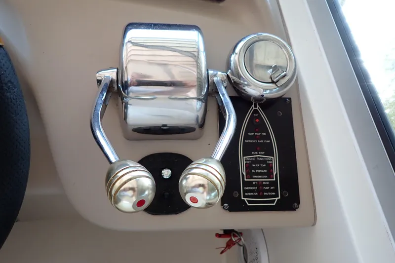 Slide: The Image of Throttle controls on a 2002 Sea Ray 340 Sundancer boat dashboard. - 45